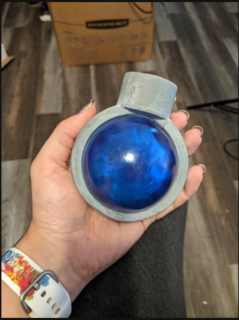 I'm holding a large blue cloudy sphere